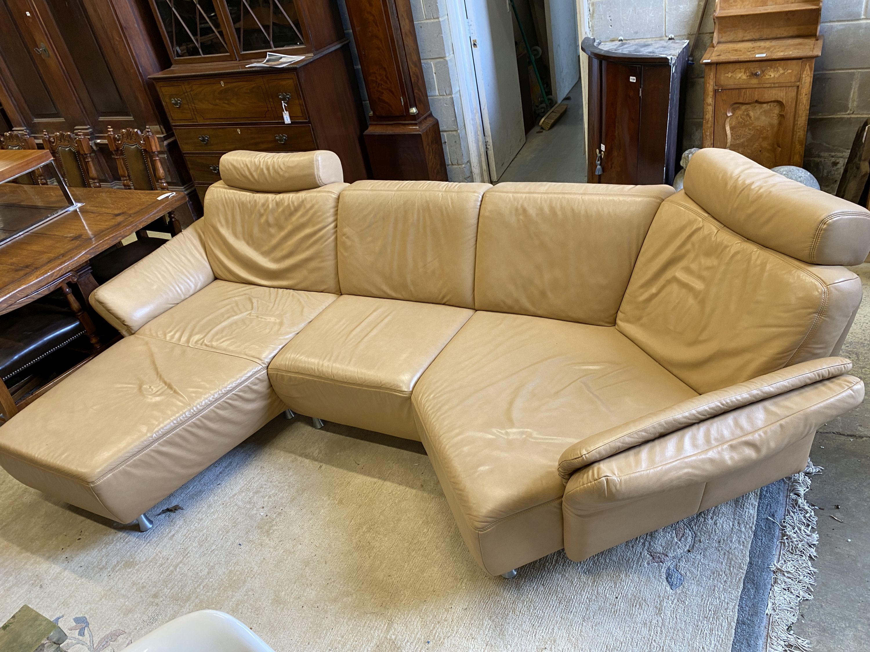An Italian beige leather curved corner sofa, length 250cm, maximum width 160cm, height 90cm